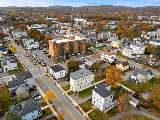 an aerial view of residential houses with outdoor space