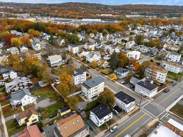 an aerial view of residential houses with outdoor space