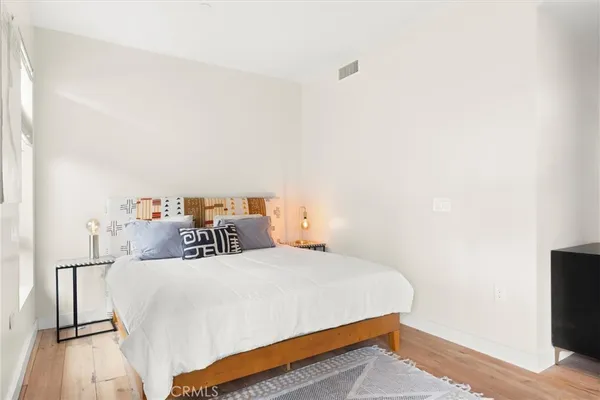 a bed room with a bed and a tv