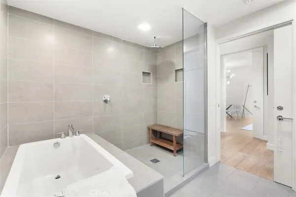 a bathroom with a tub and a sink