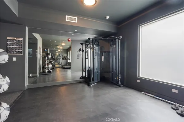 a view of a hallway with seating area