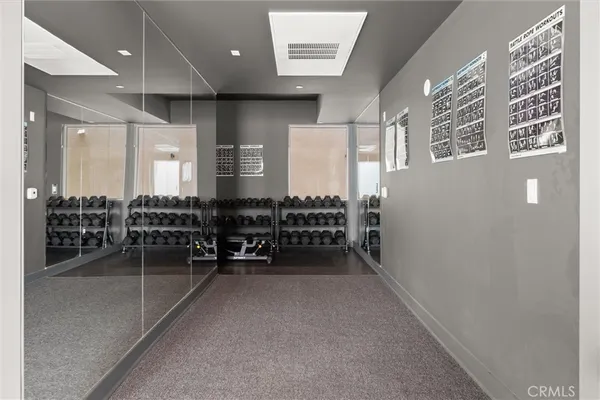 a view of parking garage with cars parked