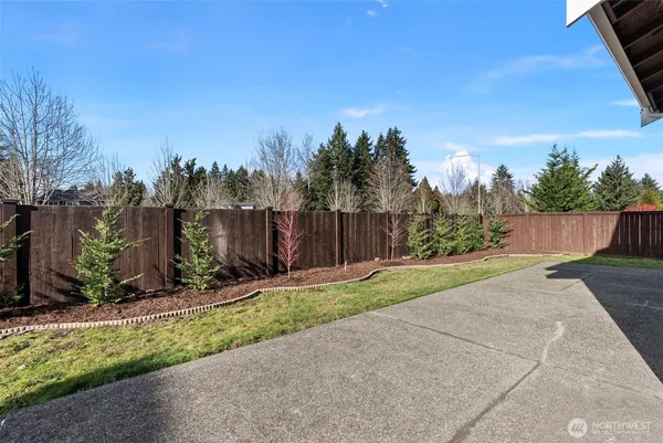a backyard of a house with lots of green space