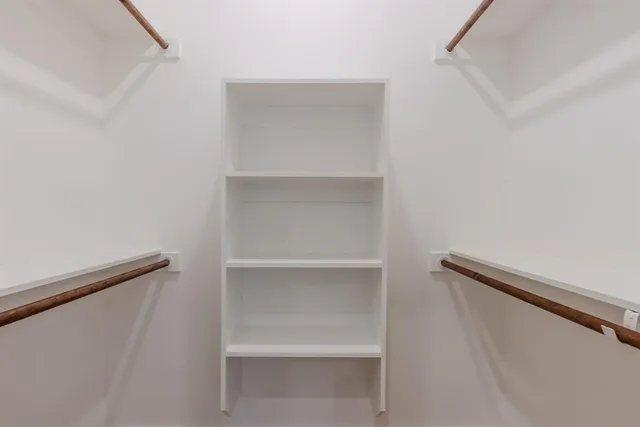 a view of an empty walk in closet