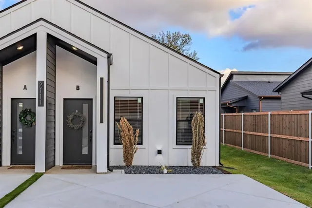 a front view of a house with garage
