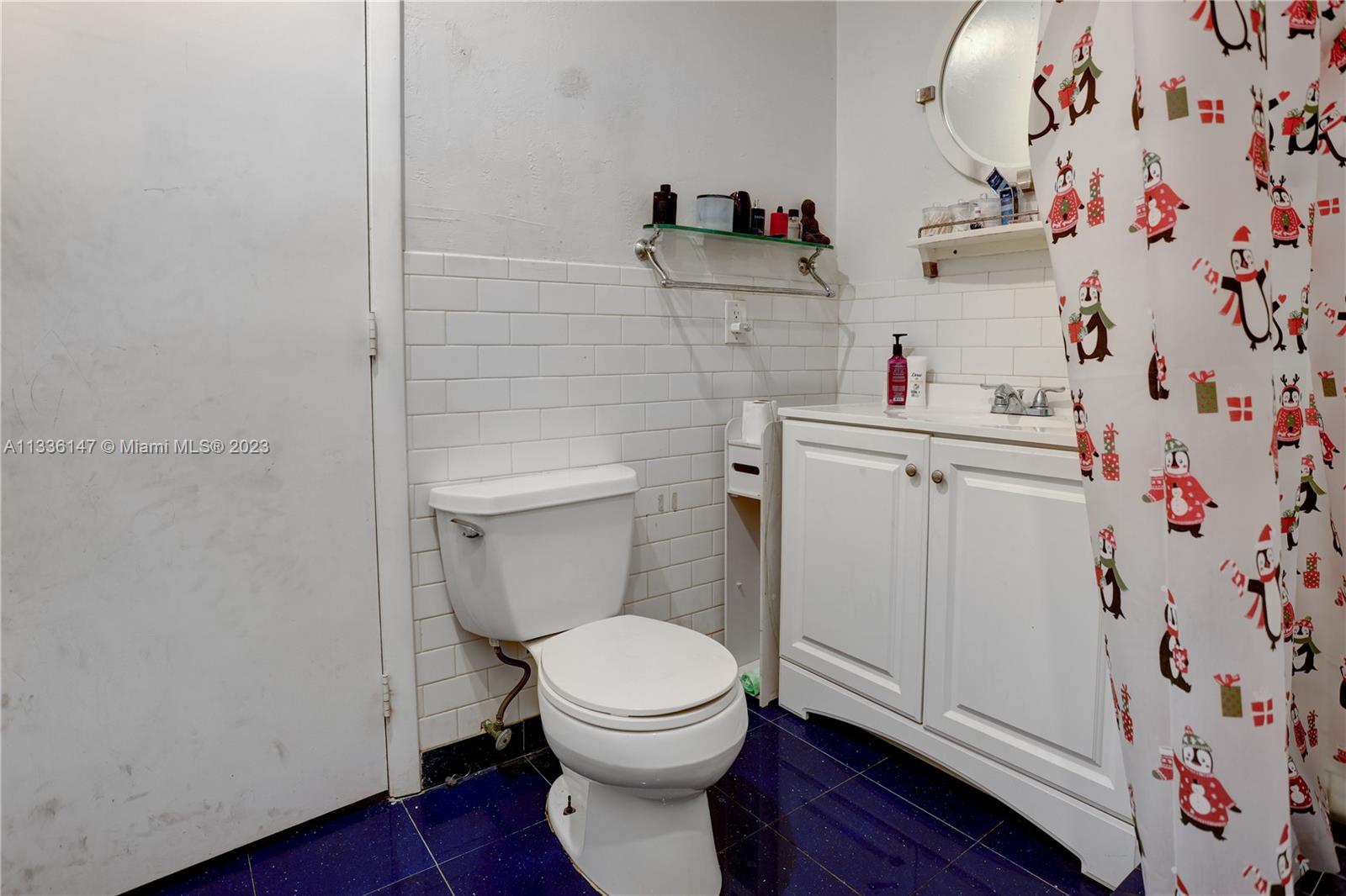 980 Southwest 15th Avenue Miami, FL 33135 - Photo 15 of 23 a bathroom with a toilet and a sink