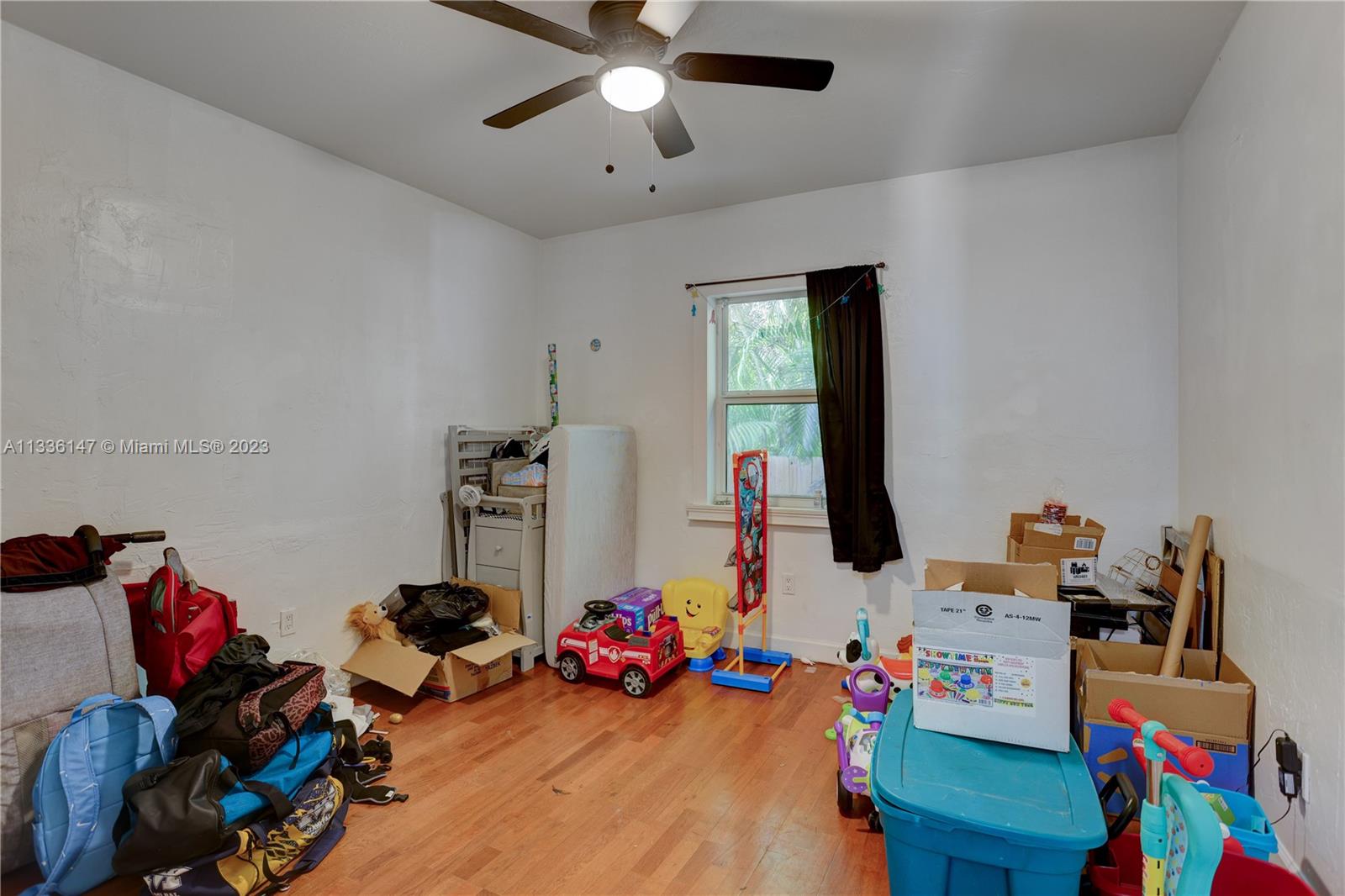 980 Southwest 15th Avenue Miami, FL 33135 - Photo 17 of 23 a view of a workspace with furniture and toys