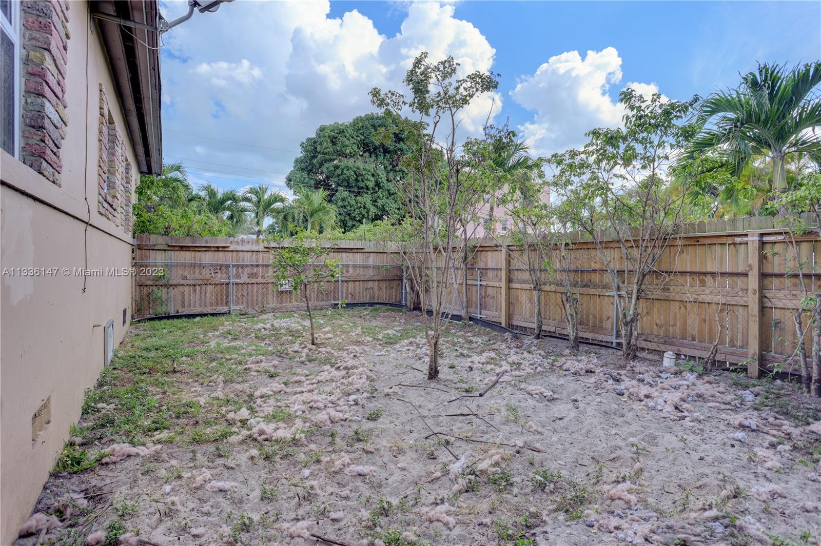 980 Southwest 15th Avenue Miami, FL 33135 - Photo 20 of 23 a backyard of a house with lots of green space