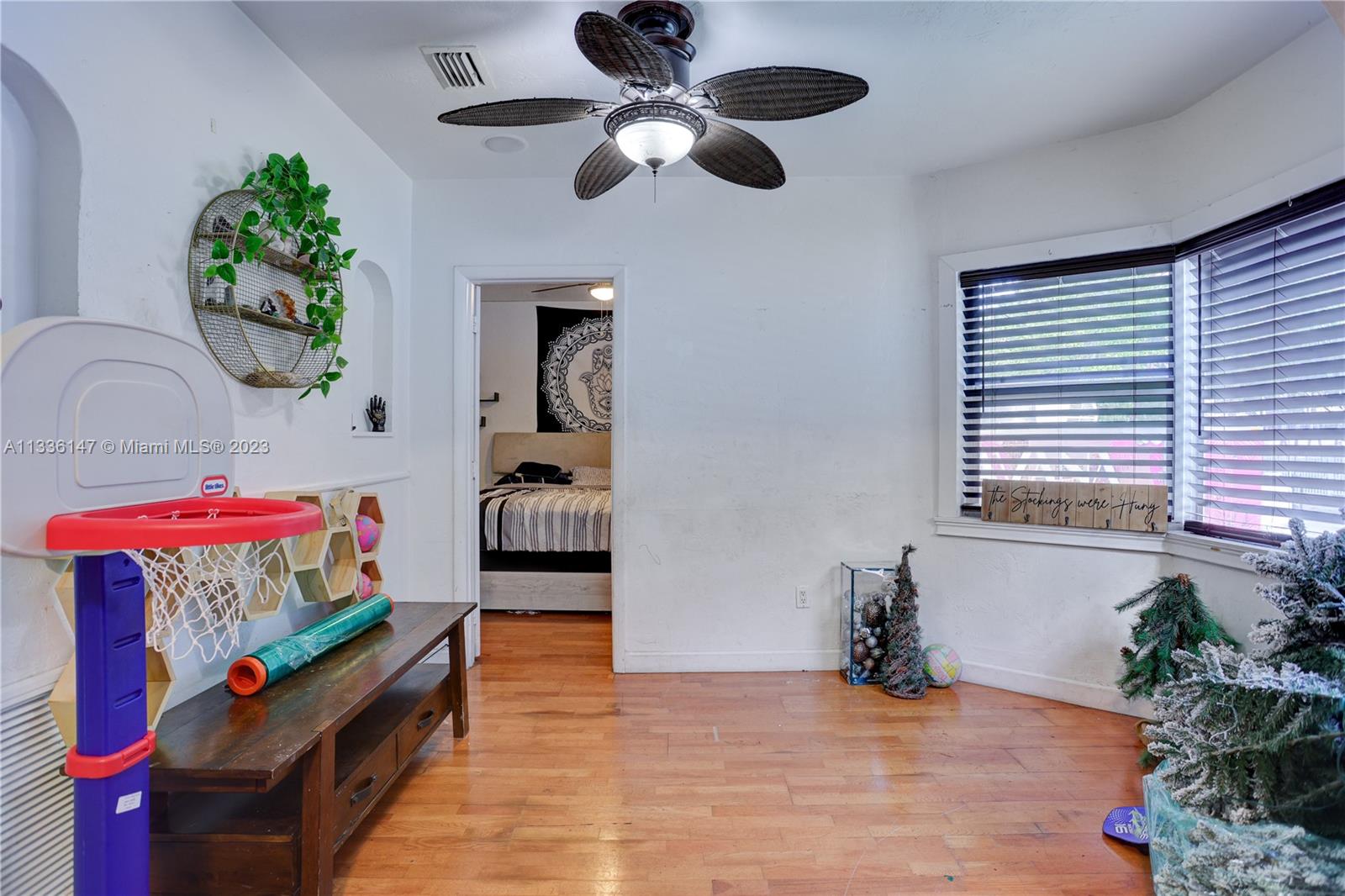 980 Southwest 15th Avenue Miami, FL 33135 - Photo 7 of 23 a living room with furniture and a chandelier