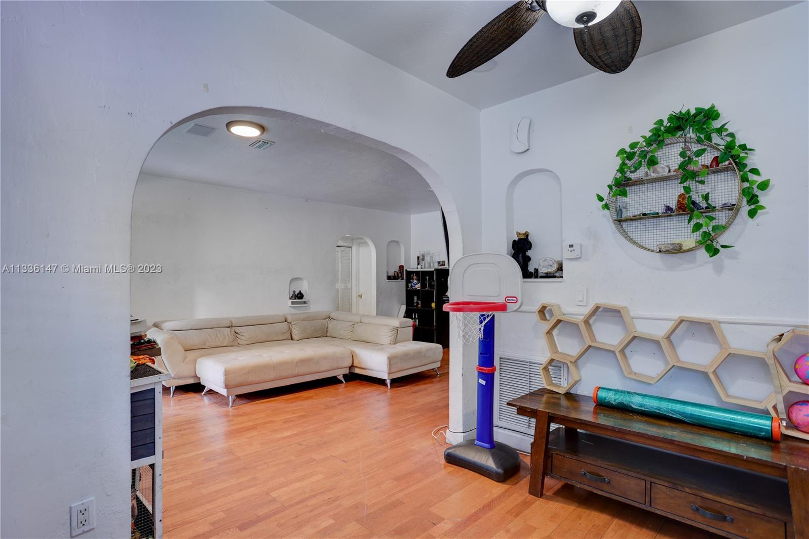 980 Southwest 15th Avenue Miami, FL 33135 - Photo 8 of 23 a living room with furniture and flat screen tv