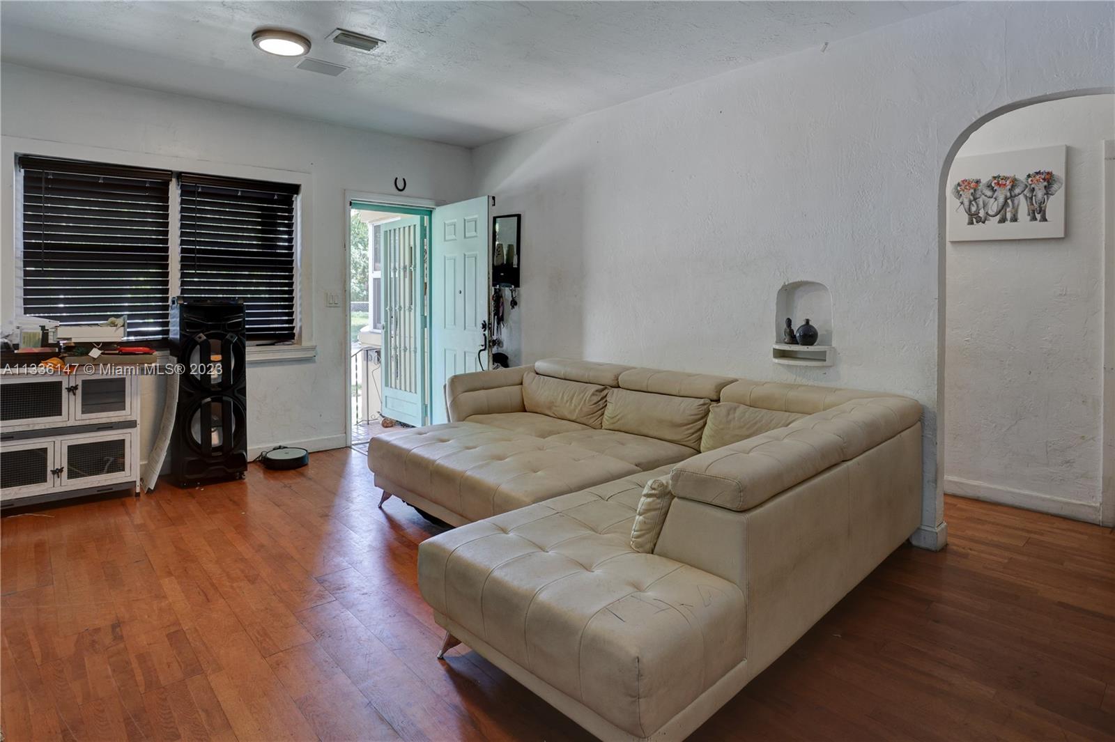 980 Southwest 15th Avenue Miami, FL 33135 - Photo 9 of 23 a living room with furniture and a flat screen tv
