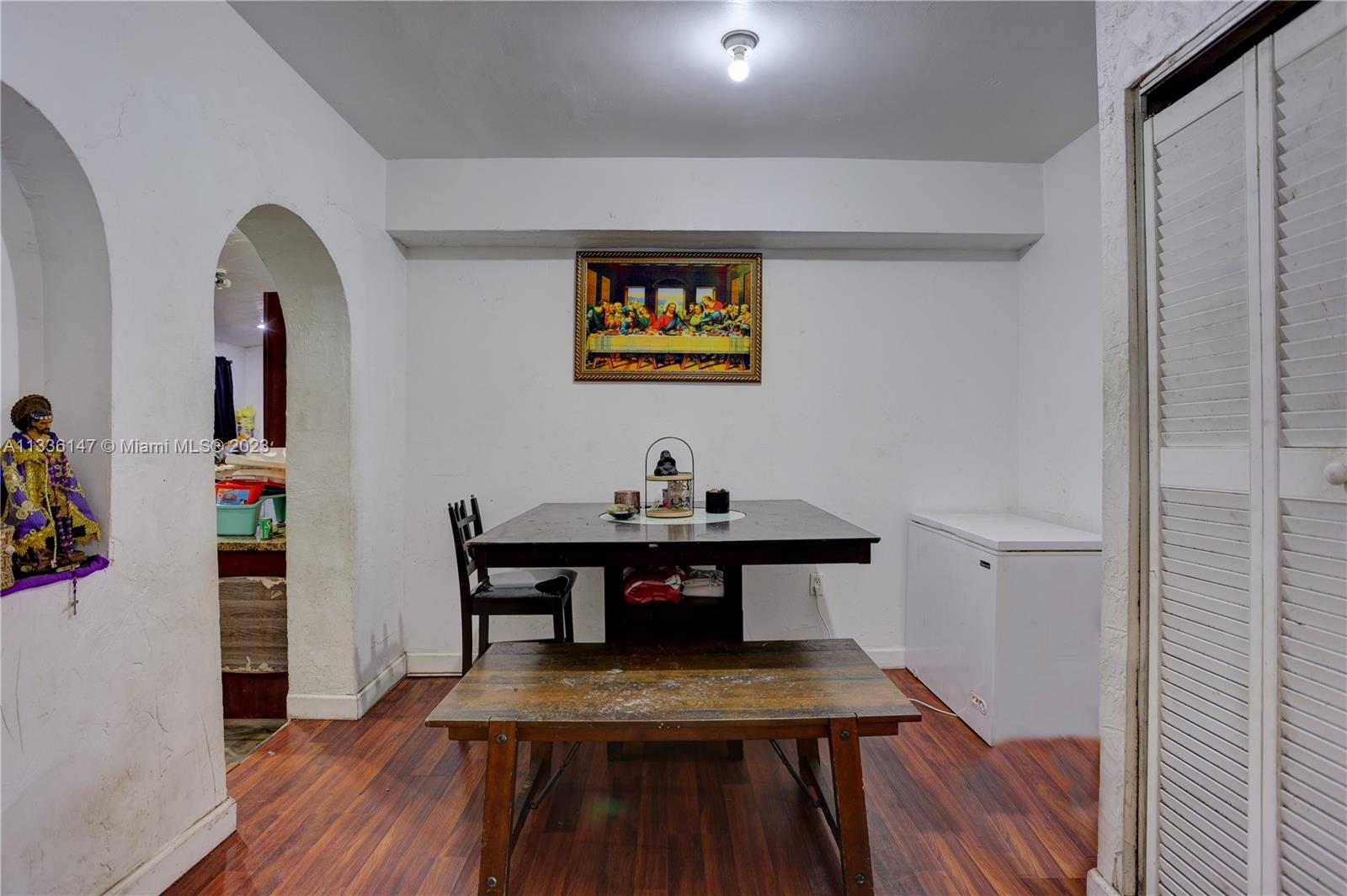 980 Southwest 15th Avenue Miami, FL 33135 - Photo 10 of 23 a view of a workspace room with wooden floor and furniture