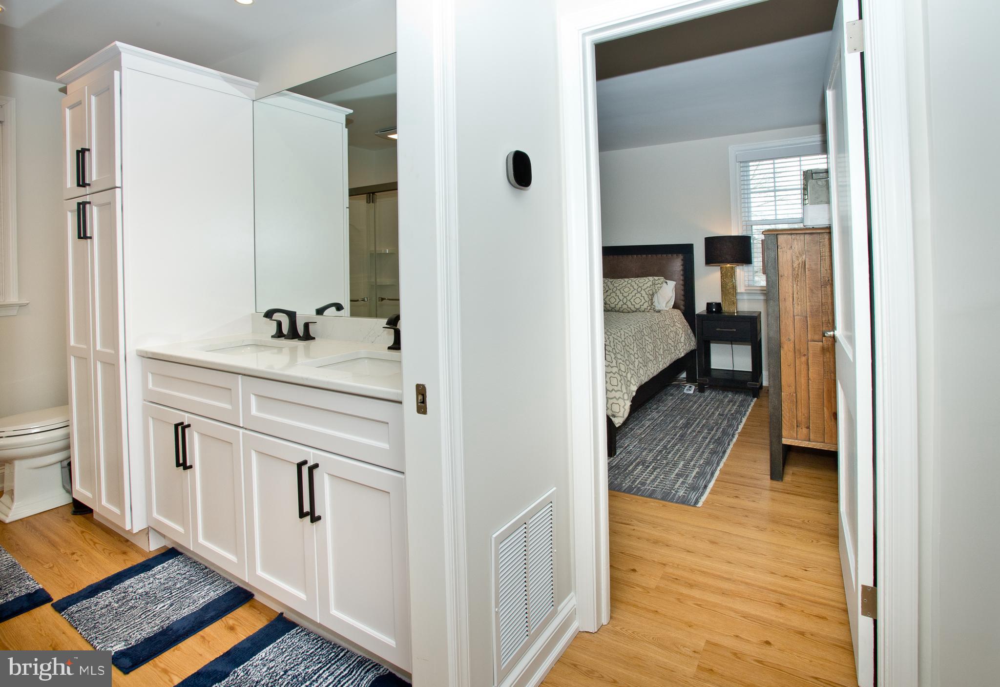 500 East Lancaster Avenue, Unit 135A Wayne, PA 19087 - Photo 13 of 24 a en suite bathroom with a sink and a mirror