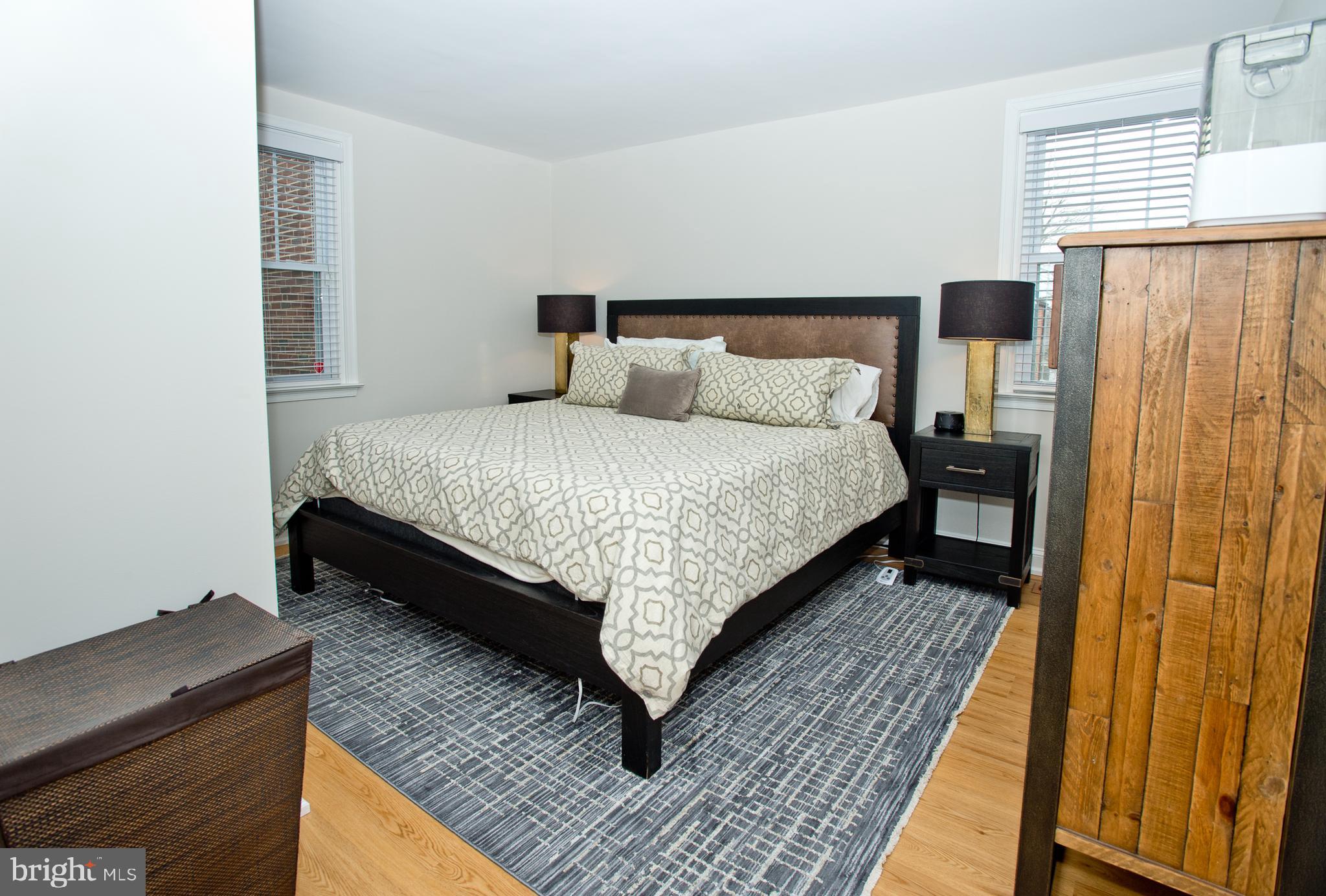 500 East Lancaster Avenue, Unit 135A Wayne, PA 19087 - Photo 17 of 24 a bed sitting in a bedroom next to a window