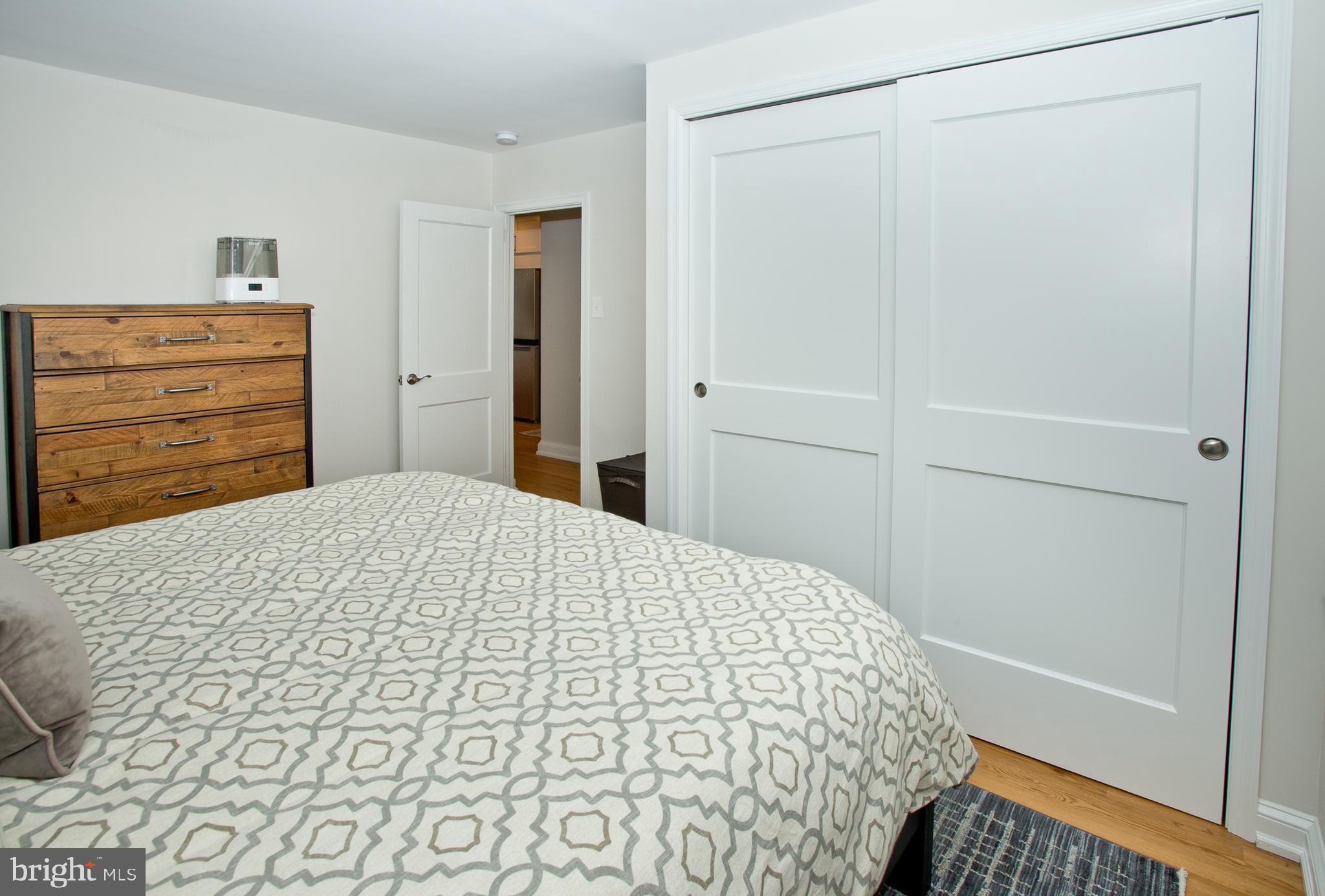 500 East Lancaster Avenue, Unit 135A Wayne, PA 19087 - Photo 18 of 24 a bedroom with a bed and cabinet