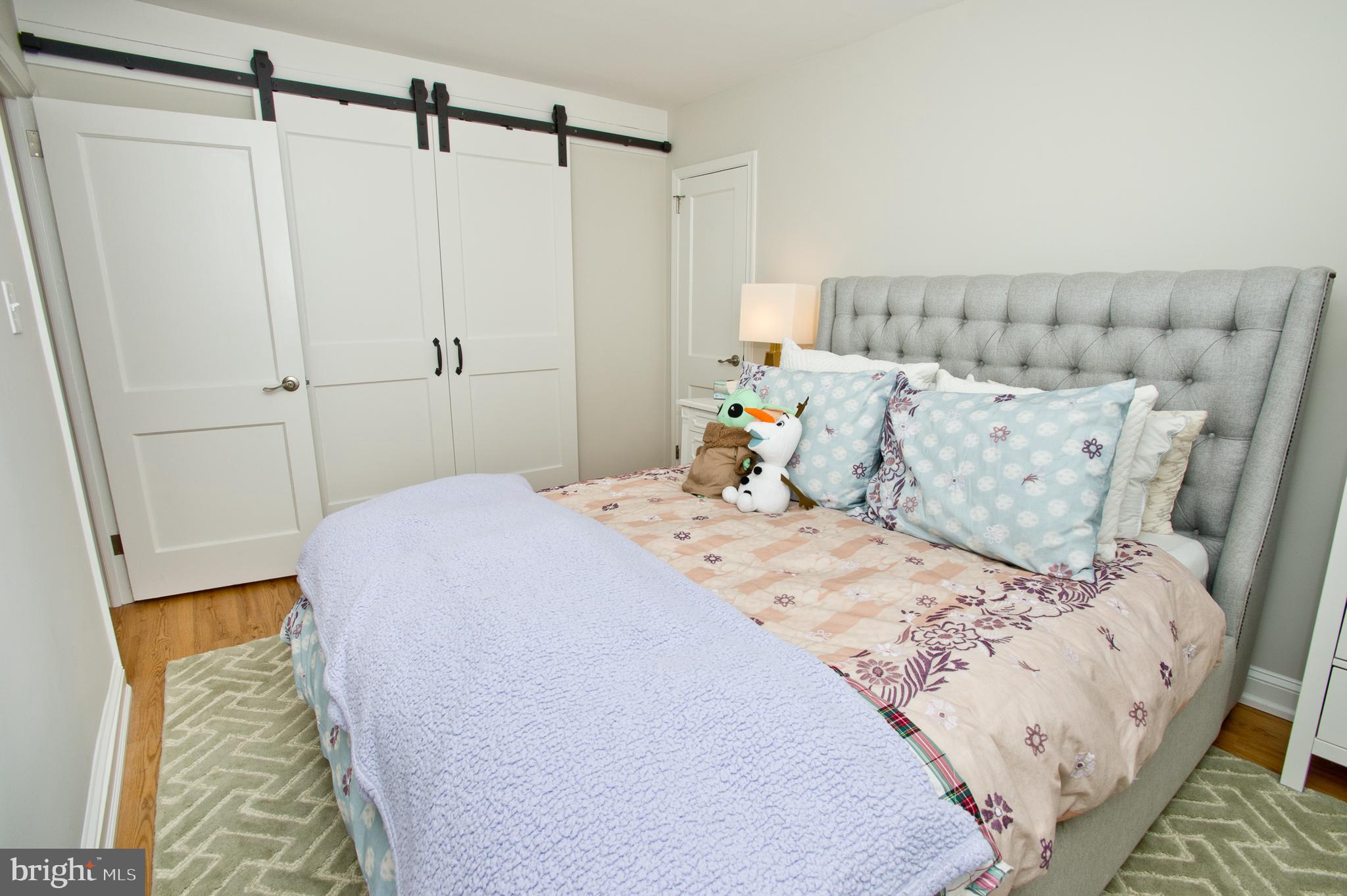 500 East Lancaster Avenue, Unit 135A Wayne, PA 19087 - Photo 20 of 24 a bedroom with a bed and a walk in closet