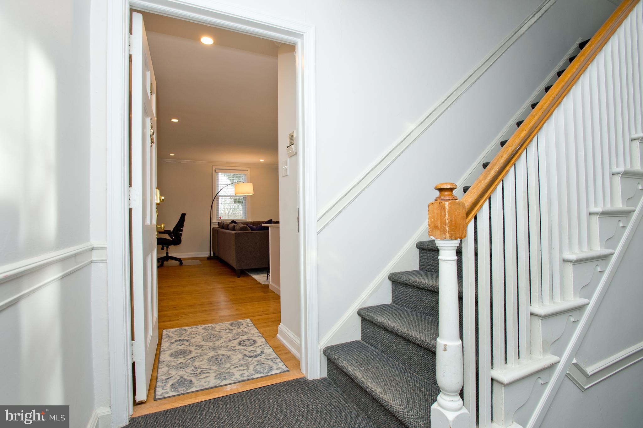 500 East Lancaster Avenue, Unit 135A Wayne, PA 19087 - Photo 6 of 24 a view of a hallway with wooden floor and stairs