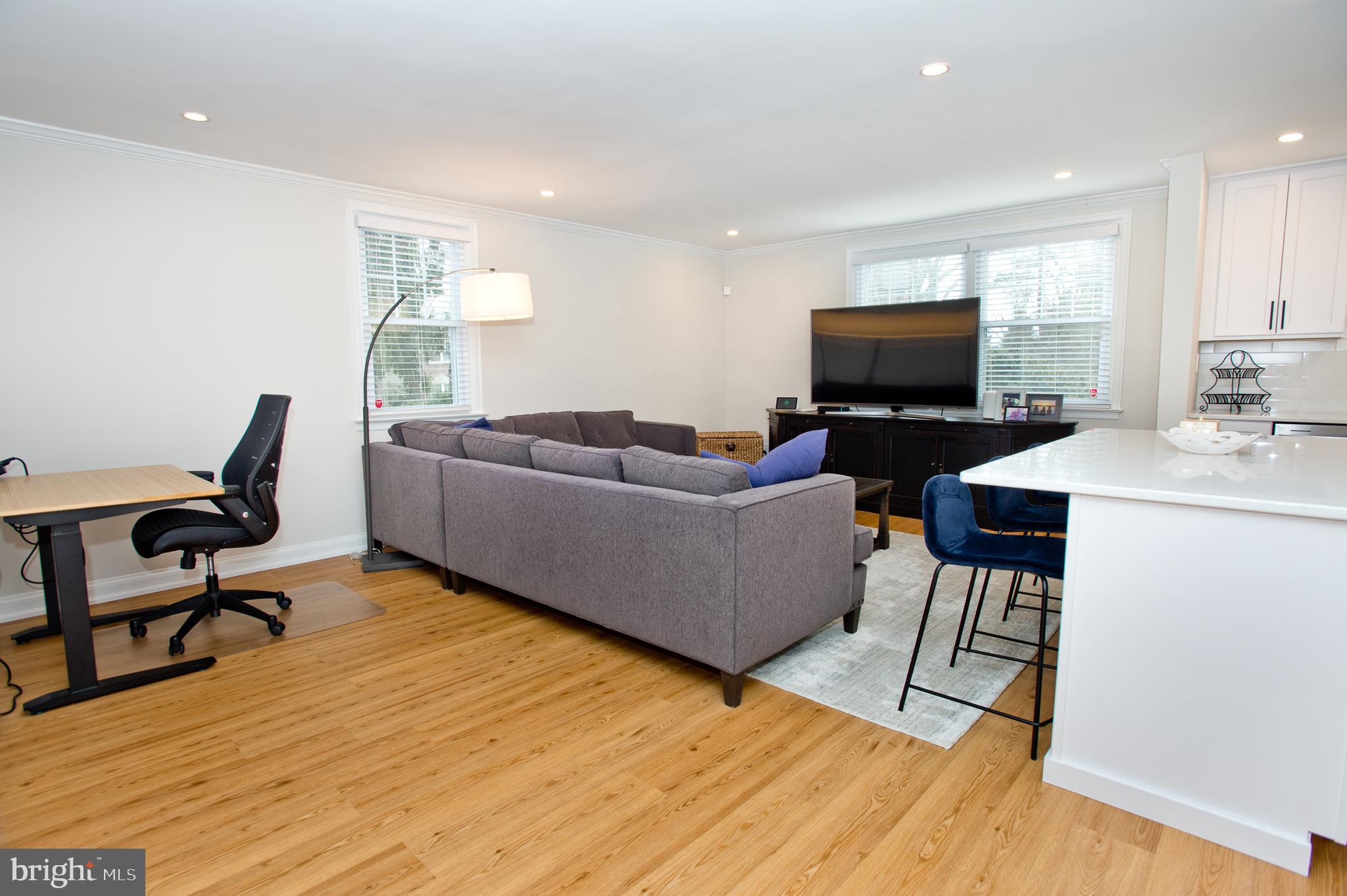 500 East Lancaster Avenue, Unit 135A Wayne, PA 19087 - Photo 8 of 24 a living room with furniture and a flat screen tv