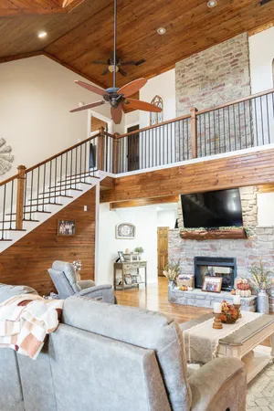 a view of a livingroom with furniture and a flat screen tv