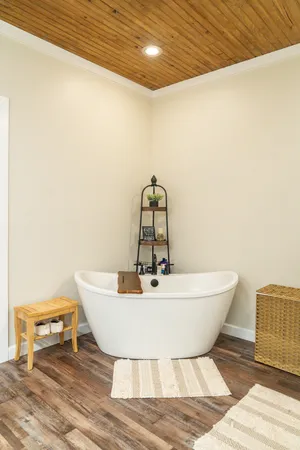 a view of a room with wooden floor and cabinet