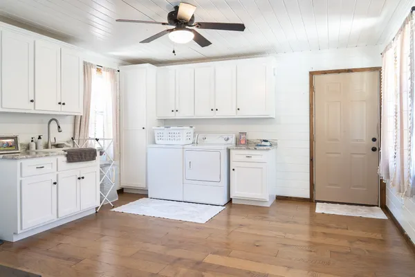 a kitchen with cabinets oven and a dishwasher