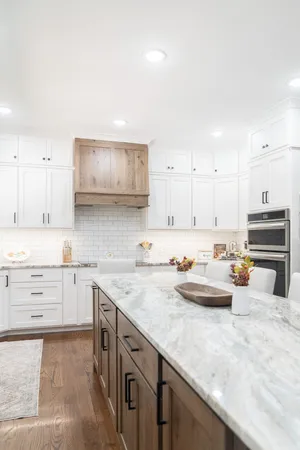 a kitchen with a sink stove and cabinets