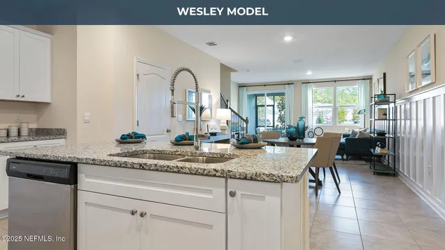 a kitchen with stainless steel appliances granite countertop a stove microwave and sink