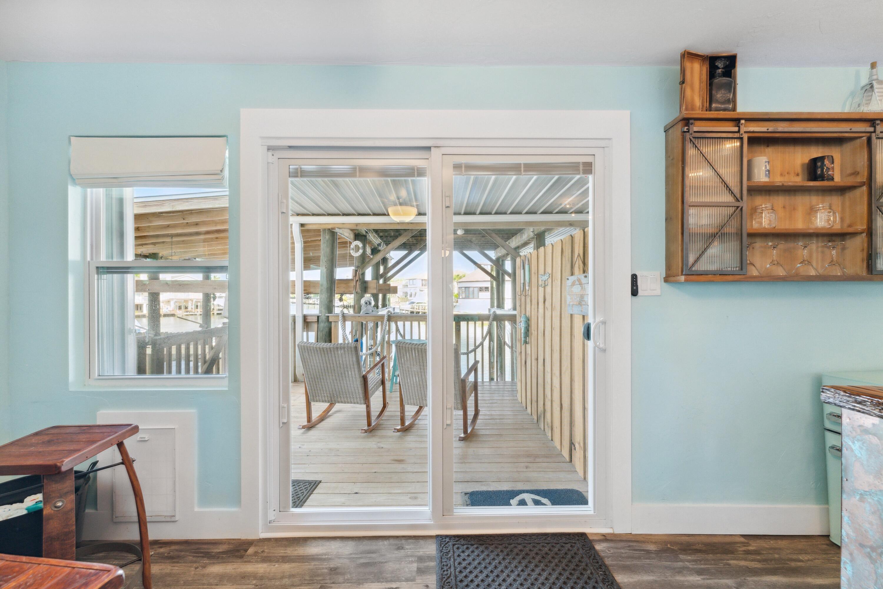 129 Durango Road, Unit 1 Destin, FL 32541 - Photo 24 of 71 a view of an entryway with wooden floor and a livingroom