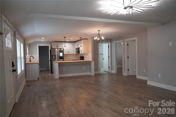 a view of a kitchen with a sink and cabinet area