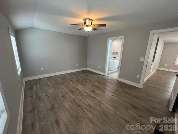 wooden floor in an empty room with a mirror