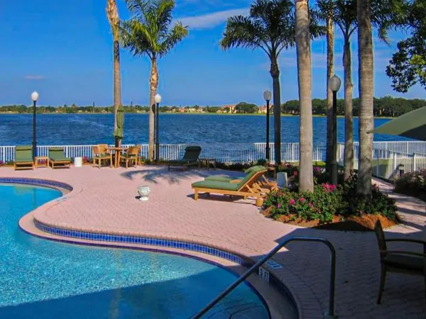 a view of swimming pool with outdoor seating