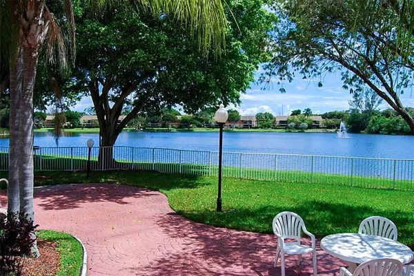 a view of a table and chairs in the garden
