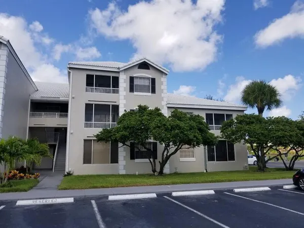 a house that has a tree in front of it