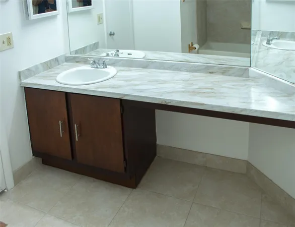 a bathroom with a sink and a mirror