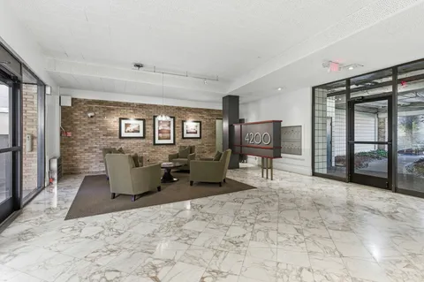 a view of a street with a building in the background