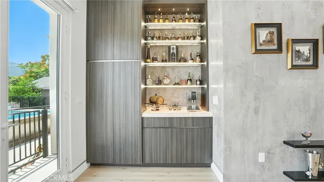 a living room with a flat screen tv and a large window