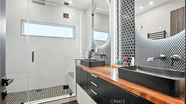 a view of a street with potted plants