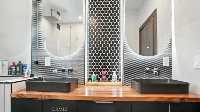 a view of a house with pool and sitting area