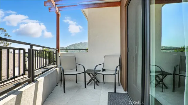 an aerial view of a house with a garden and swimming pool