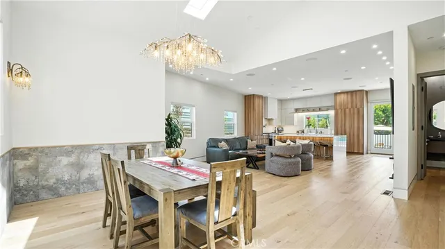 a view of a dining room with furniture and a window