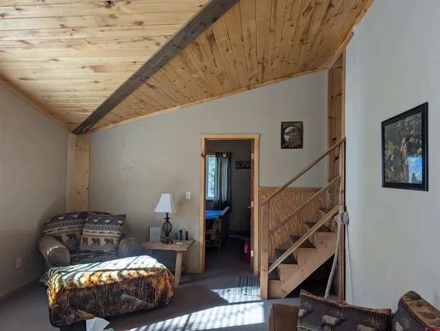 a bedroom with bed and cabinets