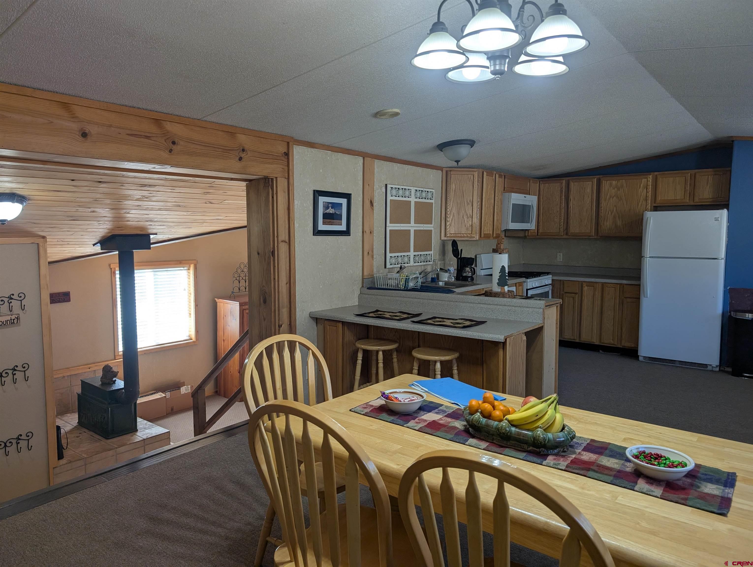 472 Haystack Circle Pagosa Springs, CO 81147 - Photo 14 of 34 a bedroom with furniture and a wooden floor