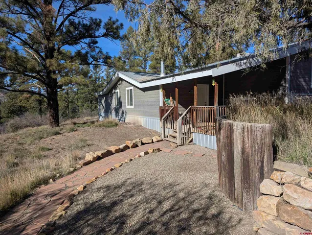 a house with trees in the background