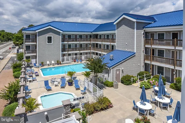 a view of swimming pool from a balcony