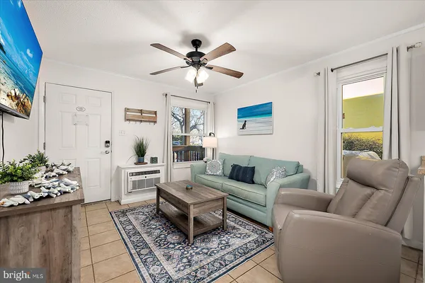 a living room with furniture and a large window