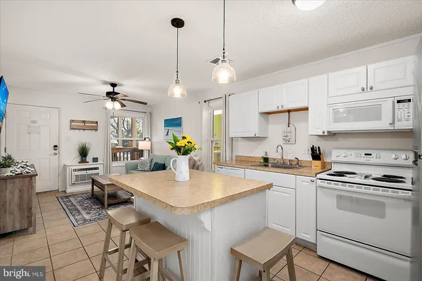 a kitchen with a stove cabinets and counter space