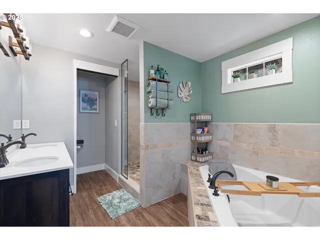 a bathroom with a sink vanity and a mirror