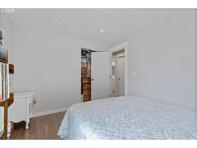 a bedroom with a bed and a cabinets