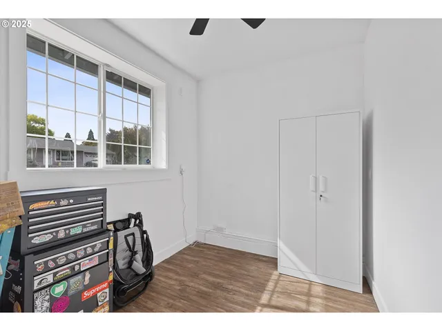 a view of a livingroom with furniture and staircase