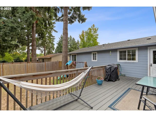 a view of balcony with wooden floor and outdoor seating
